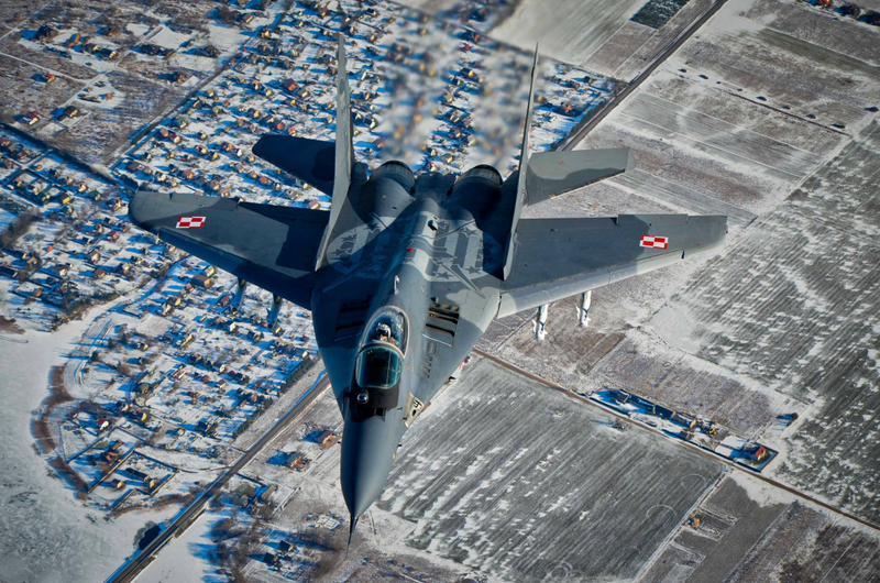 Illustration for article titled These Shots Of Fulcrums and Eurofighters Over Lithuania Are Amazing